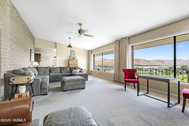 1011 N 42nd Pl, Yakima, WA 98908 - living room featuring a mountain view, ceiling fan, carpet, lofted ceiling, and brick wall