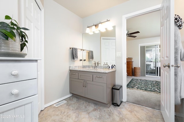 606 N 65th Ave, Yakima, WA 98908 - bathroom featuring baseboards, visible vents, vanity, and ceiling fan
