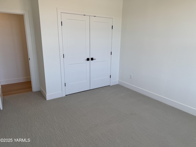 202 E Ian Ave, Ellensburg, WA 98926 - unfurnished bedroom featuring light carpet and a closet