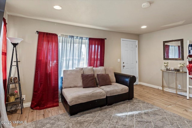living room with recessed lighting, wood finished floors, and baseboards