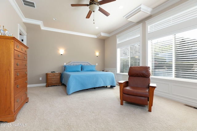bedroom with light carpet, visible vents, and crown molding