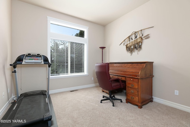 carpeted office featuring baseboards and visible vents