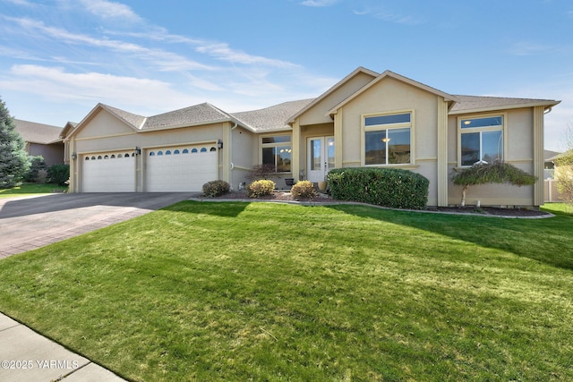 ranch-style house with a front yard, driveway, a garage, and stucco siding