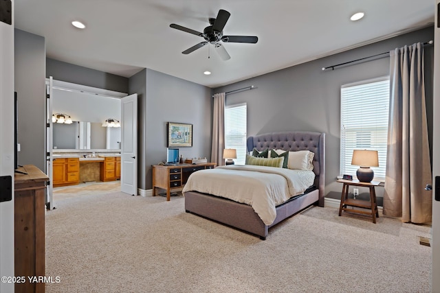 7506 Lyons Ln, Yakima, WA 98903 - bedroom featuring light carpet, baseboards, connected bathroom, recessed lighting, and a desk