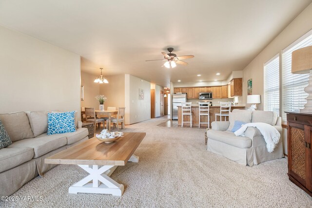 19 N 86th Ave, Yakima, WA 98908 - living room featuring light colored carpet, recessed lighting, and ceiling fan with notable chandelier