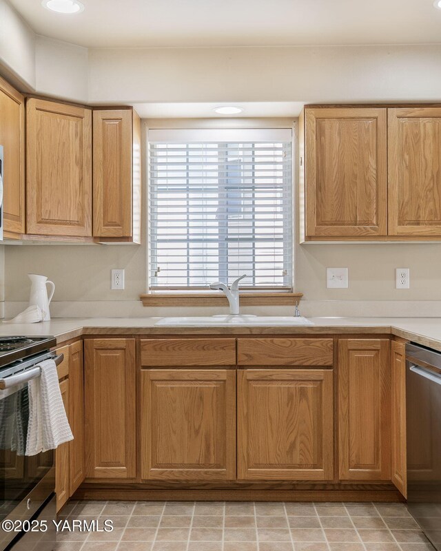 19 N 86th Ave, Yakima, WA 98908 - kitchen featuring light countertops, stainless steel appliances, and a sink