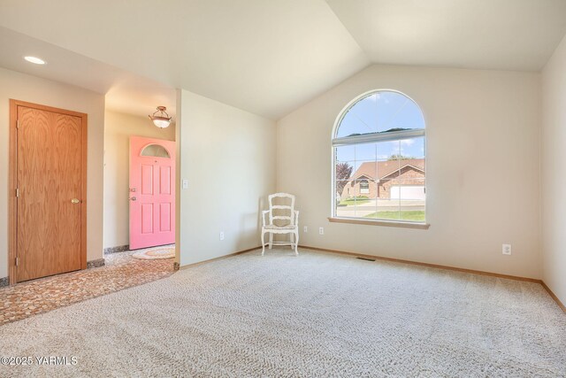 19 N 86th Ave, Yakima, WA 98908 - unfurnished room featuring carpet floors, visible vents, lofted ceiling, and baseboards