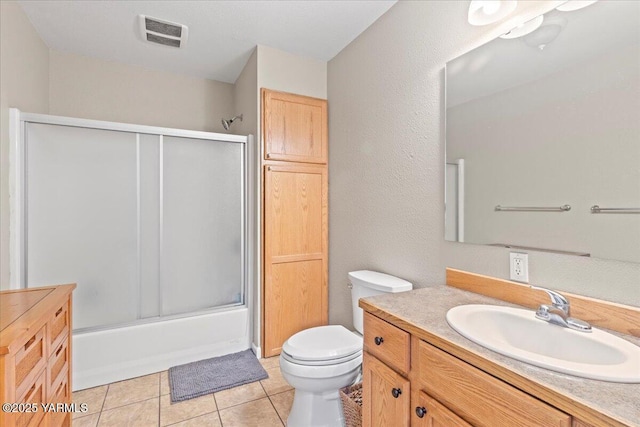 8301 Aspen Rd, Yakima, WA 98903 - bathroom featuring vanity, combined bath / shower with glass door, and tile patterned floors