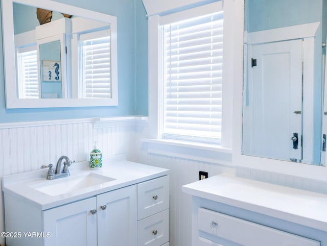 175001 W King Tull Rd, Grandview, WA 98930 - bathroom with vanity and a wainscoted wall
