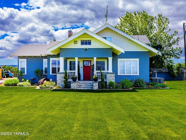 175001 W King Tull Rd, Grandview, WA 98930 - craftsman-style house with a chimney, covered porch, and a front lawn