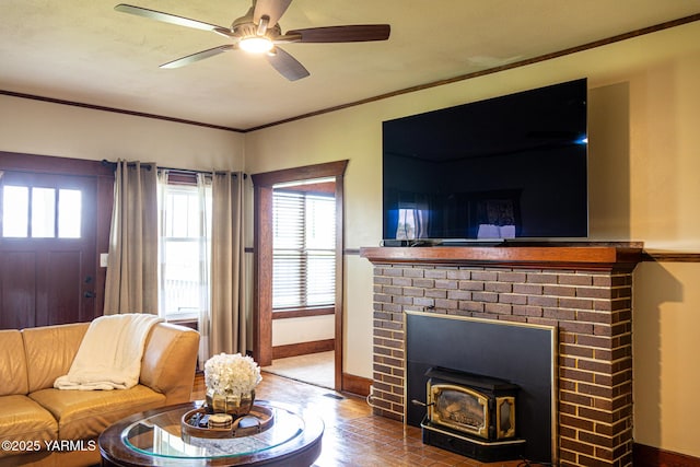 175001 W King Tull Rd, Grandview, WA 98930 - living room with plenty of natural light, ceiling fan, baseboards, crown molding, and a wood stove