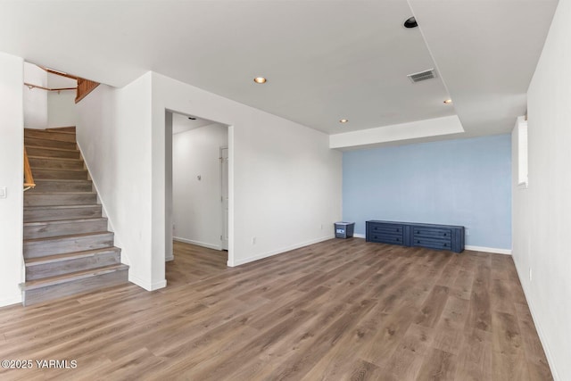 190 Shadbolt Rd, Yakima, WA 98908 - unfurnished living room featuring stairway, light wood-style flooring, recessed lighting, and baseboards