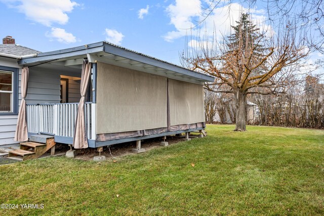 view of property exterior with a yard