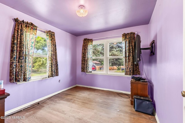 3212 W Lincoln Ave, Yakima, WA 98902 - empty room featuring wood finished floors and baseboards