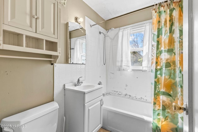 3212 W Lincoln Ave, Yakima, WA 98902 - full bath featuring shower / bath combo with shower curtain, toilet, vanity, tasteful backsplash, and tile walls