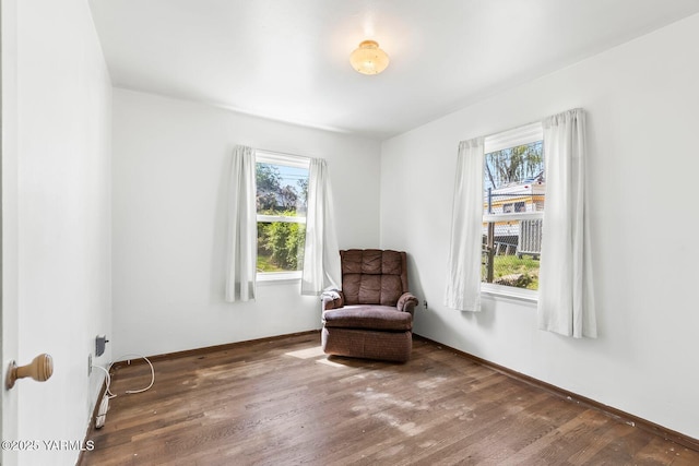 3212 W Lincoln Ave, Yakima, WA 98902 - living area featuring healthy amount of natural light, wood finished floors, and baseboards