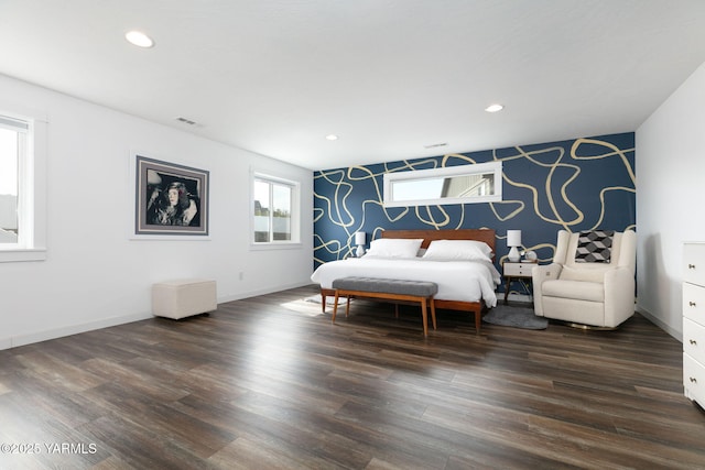 7902 W Whatcom Ave, Yakima, WA 98903 - bedroom featuring visible vents, baseboards, an accent wall, and dark wood finished floors
