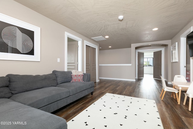 7902 W Whatcom Ave, Yakima, WA 98903 - living room featuring visible vents, recessed lighting, dark wood finished floors, and baseboards