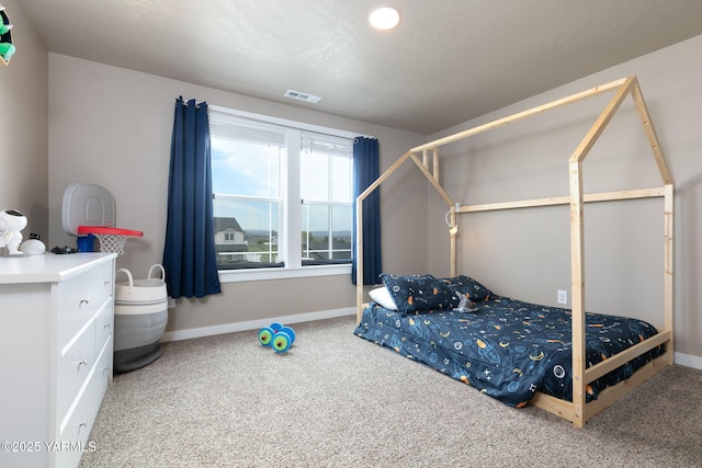 7902 W Whatcom Ave, Yakima, WA 98903 - bedroom featuring baseboards, visible vents, and carpet