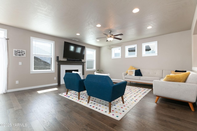 7902 W Whatcom Ave, Yakima, WA 98903 - living room with a ceiling fan, a fireplace, wood finished floors, baseboards, and recessed lighting