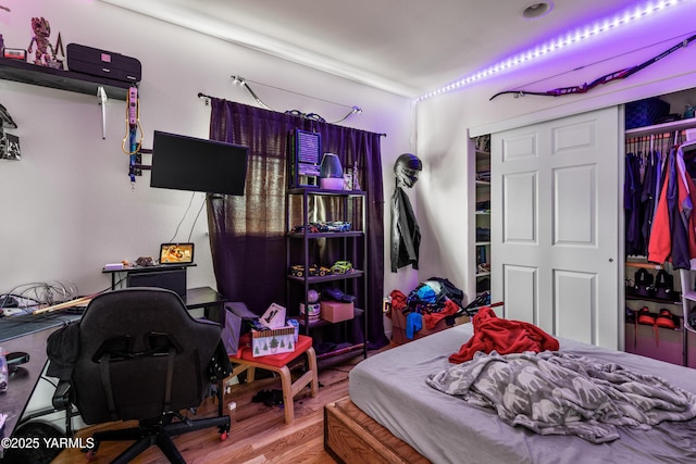 bedroom featuring a closet and wood finished floors