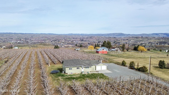 birds eye view of property featuring a rural view and a mountain view