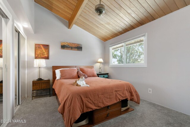 bedroom featuring a closet, wooden ceiling, carpet flooring, and lofted ceiling with beams