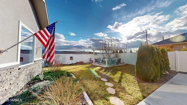 view of yard with a fenced backyard