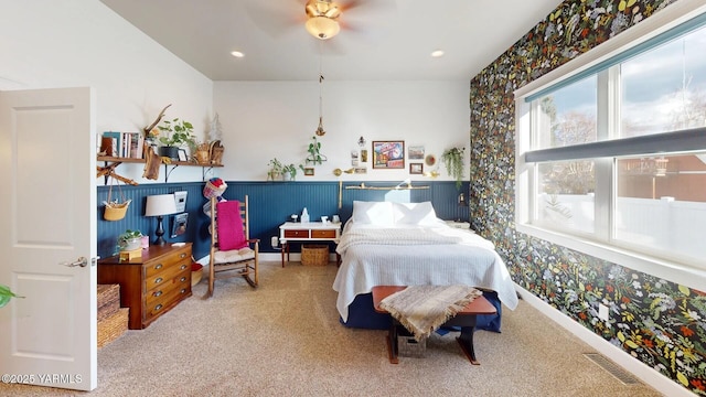 carpeted bedroom featuring baseboards, visible vents, a ceiling fan, and recessed lighting