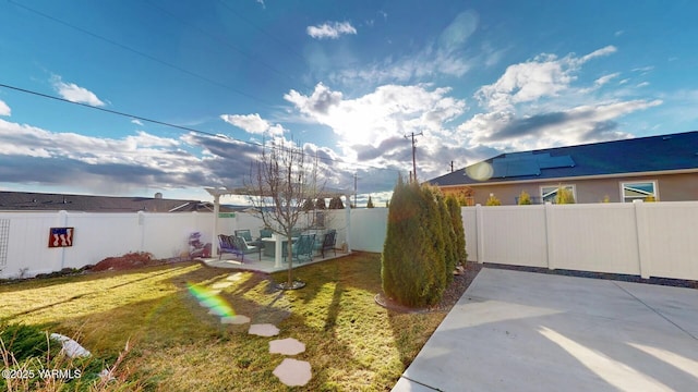 view of yard featuring a patio area and a fenced backyard