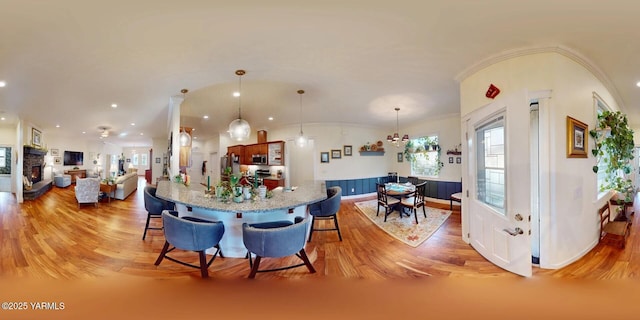 dining room featuring a healthy amount of sunlight and light wood-style flooring