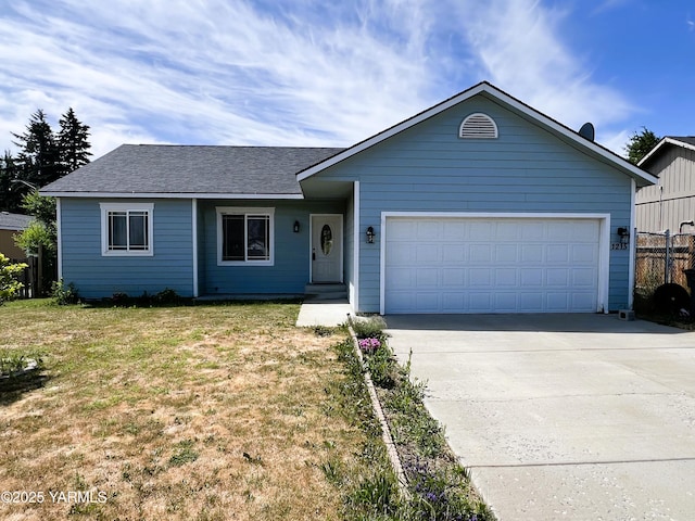 1215 Vineyard Dr, Tieton, WA 98947 - ranch-style home with concrete driveway, a garage, and a shingled roof