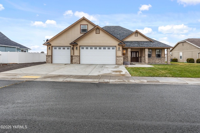 1008 S 91st Ave, Yakima, WA 98908 - view of front of house featuring brick siding, driveway, and an attached garage