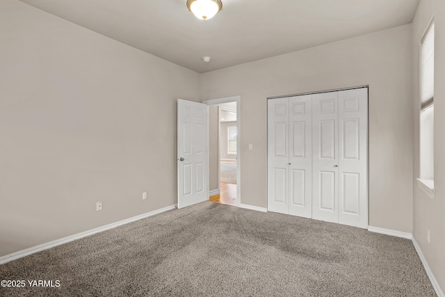 1008 S 91st Ave, Yakima, WA 98908 - unfurnished bedroom with carpet, baseboards, and a closet