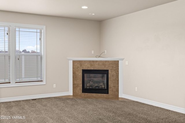 1008 S 91st Ave, Yakima, WA 98908 - unfurnished living room featuring a tile fireplace, carpet floors, baseboards, and recessed lighting