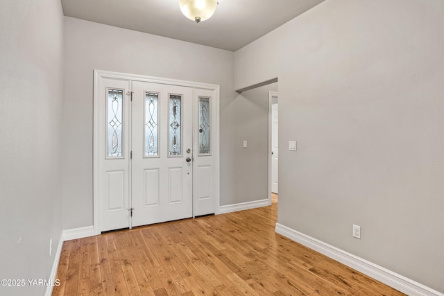 1008 S 91st Ave, Yakima, WA 98908 - entryway with baseboards and light wood-style flooring
