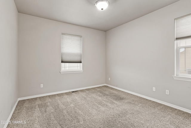 1008 S 91st Ave, Yakima, WA 98908 - empty room featuring carpet, plenty of natural light, and baseboards