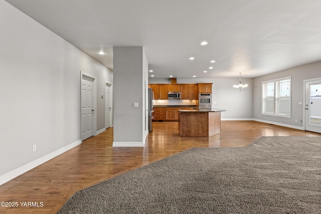 1008 S 91st Ave, Yakima, WA 98908 - kitchen featuring open floor plan, stainless steel appliances, a chandelier, light wood-type flooring, and recessed lighting