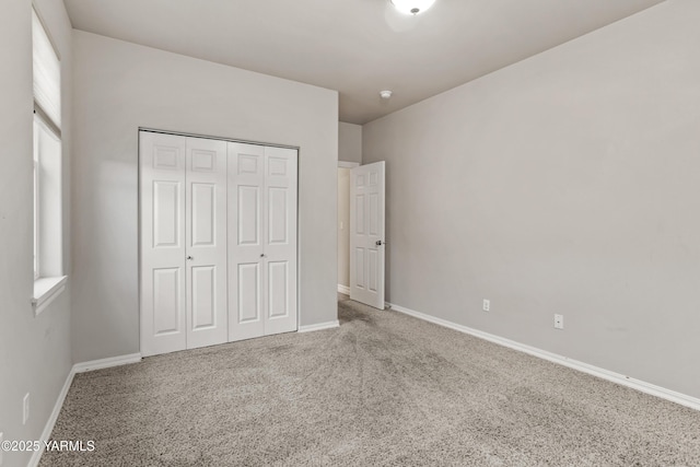 1008 S 91st Ave, Yakima, WA 98908 - unfurnished bedroom with carpet, baseboards, and a closet