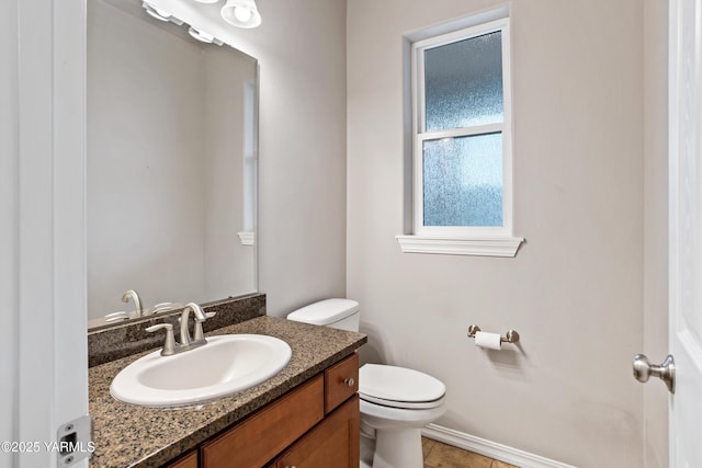 1008 S 91st Ave, Yakima, WA 98908 - bathroom with toilet, vanity, and baseboards