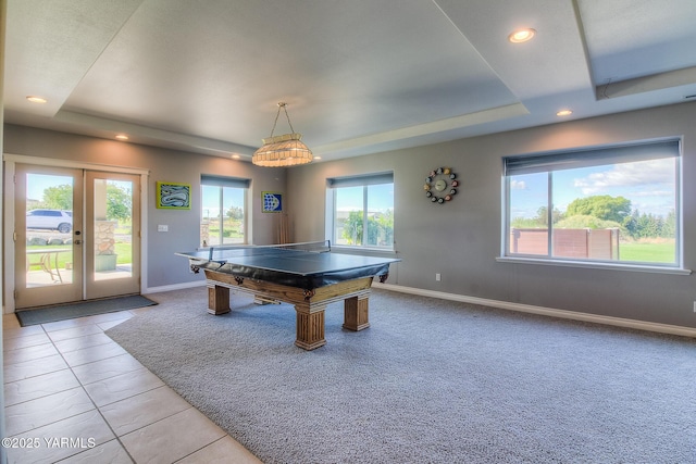 playroom with baseboards, light colored carpet, a tray ceiling, french doors, and recessed lighting