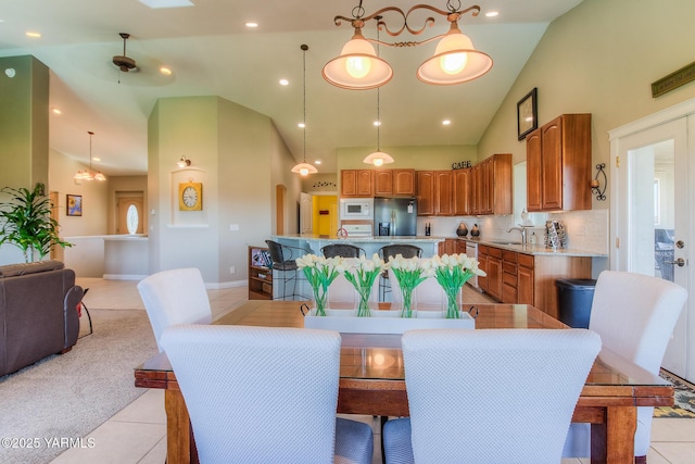 dining room featuring recessed lighting, high vaulted ceiling, and light tile patterned flooring