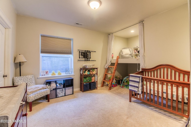 bedroom featuring light colored carpet, visible vents, and baseboards