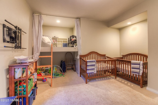 carpeted bedroom featuring baseboards