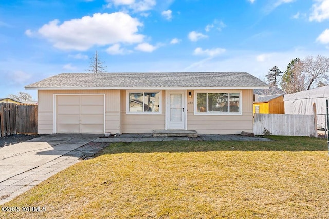 single story home with a garage, a shingled roof, concrete driveway, fence, and a front lawn