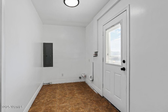 washroom with laundry area, electric panel, baseboards, and tile patterned floors