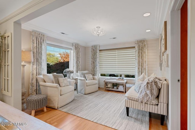 sitting room featuring recessed lighting, wood finished floors, visible vents, and crown molding