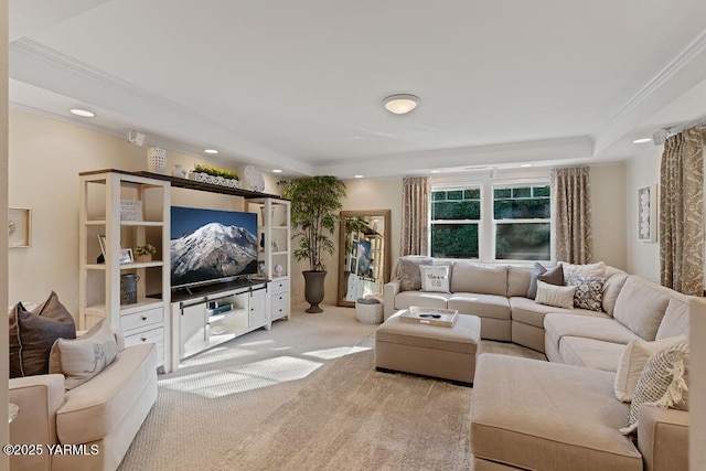 living room featuring light carpet, a tray ceiling, crown molding, and recessed lighting