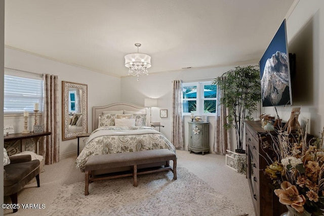 bedroom with crown molding, multiple windows, light colored carpet, and an inviting chandelier