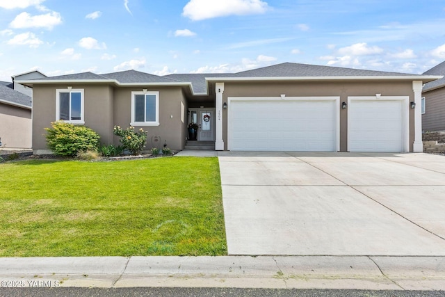 1504 W Naches Ave, Selah, WA 98942 - view of front facade with stucco siding, an attached garage, concrete driveway, and a front lawn